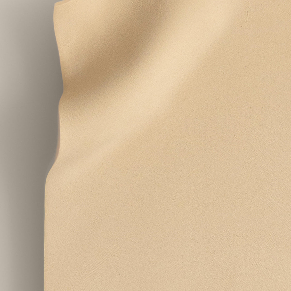 Writings 003 by Studio JOA — close-up of the pinched fold in Butter Yellow stoneware, showing the hand-brushed surface texture