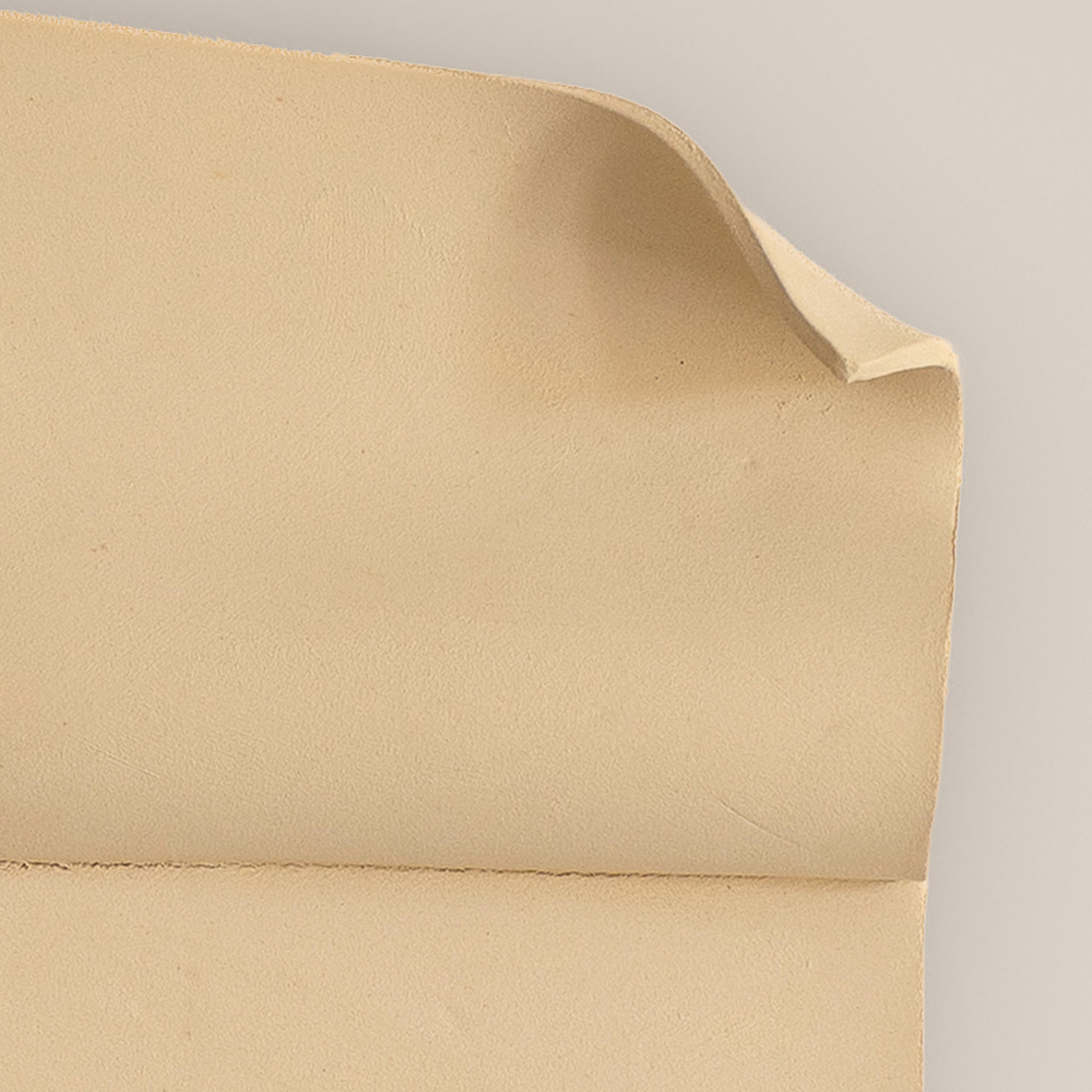 Writings 001 by Studio JOA — close-up of the folded curl in Butter Yellow stoneware, showing the hand-brushed surface texture