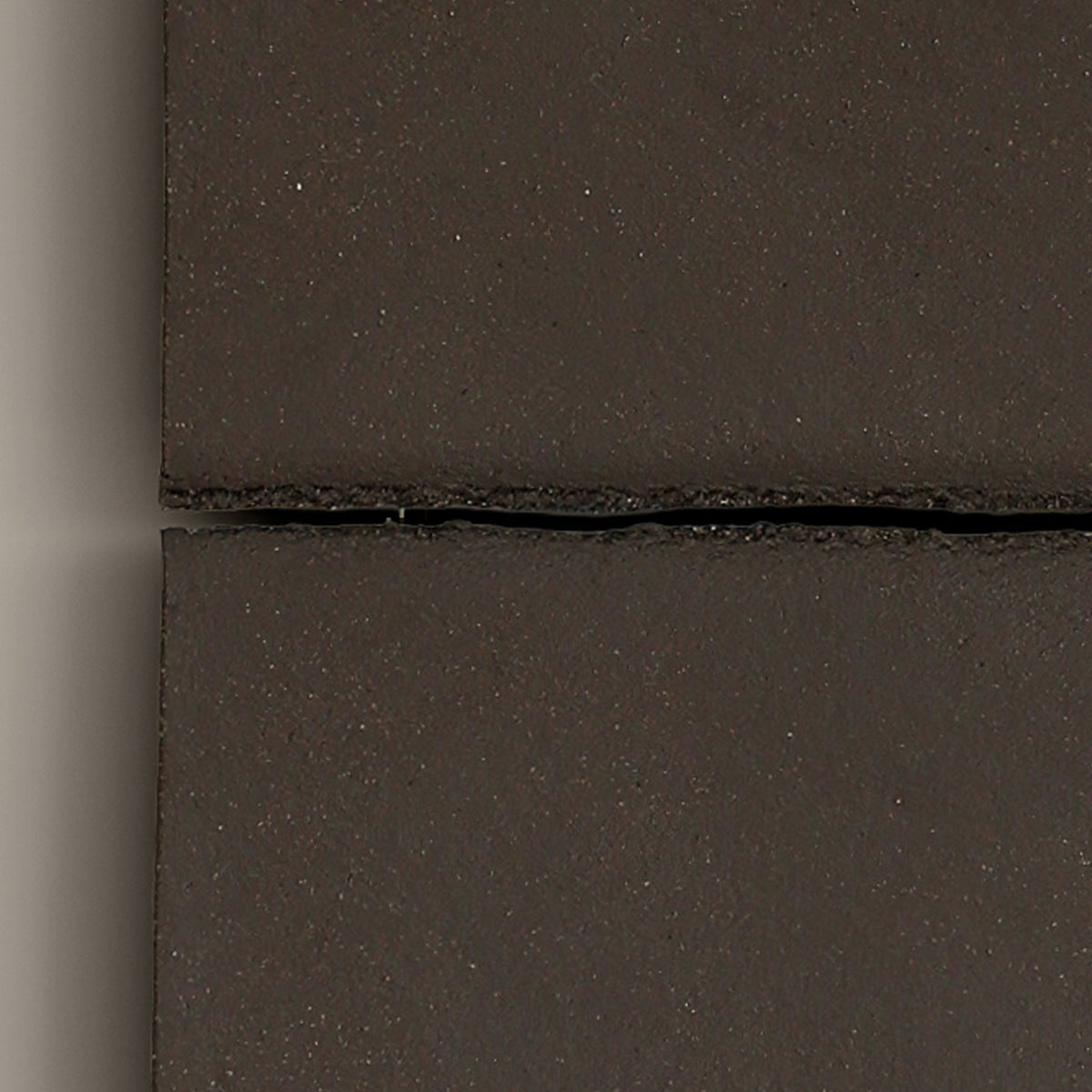 Writings 002 by Studio JOA — close-up of the horizontal seam in Dark Brown stoneware, showing the hand-brushed surface texture