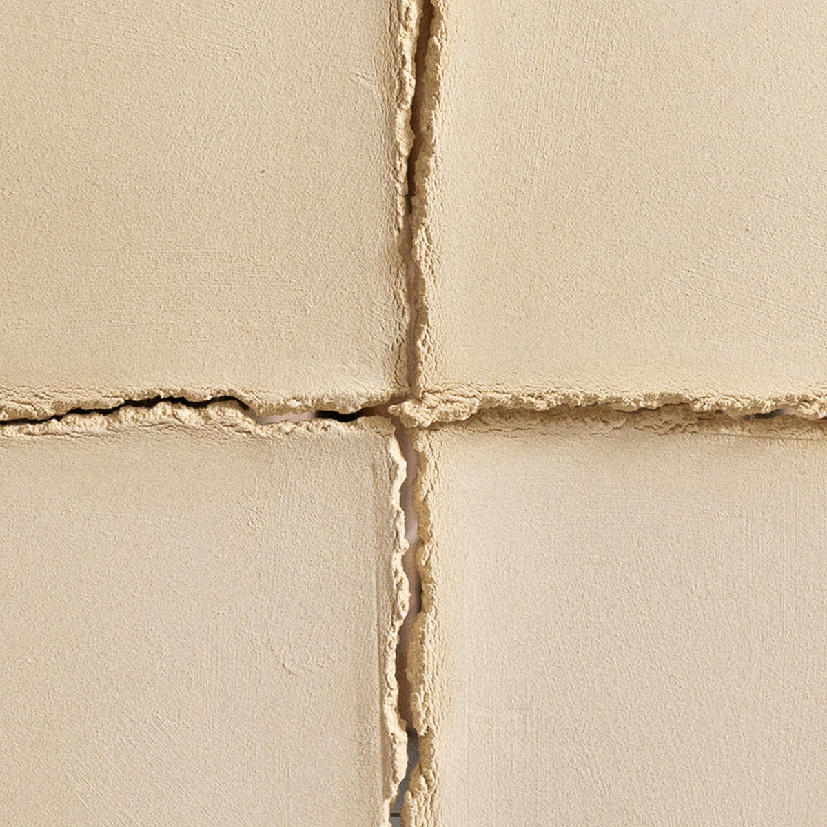 Writings 004 by Studio JOA — close-up of the cross-shaped seam in Butter Yellow stoneware, showing the hand-brushed surface texture