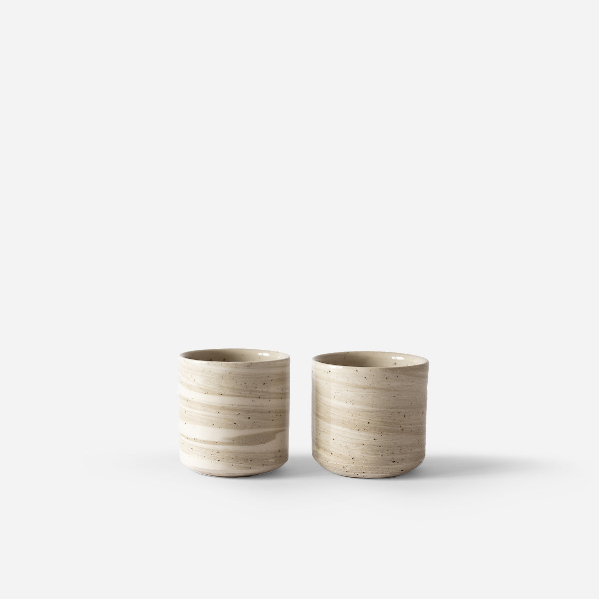 Set of two light marbled cups